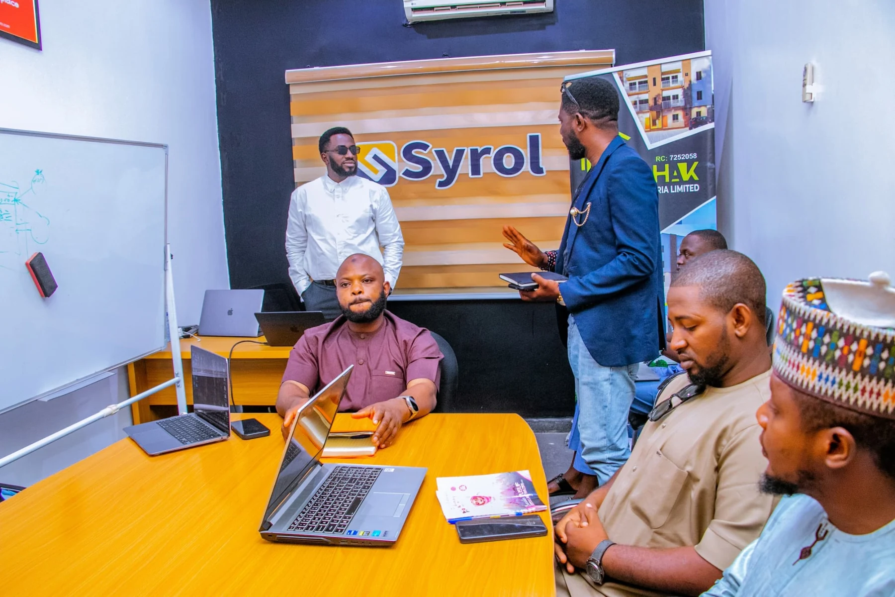Syrol professionals collaborating in a strategy session