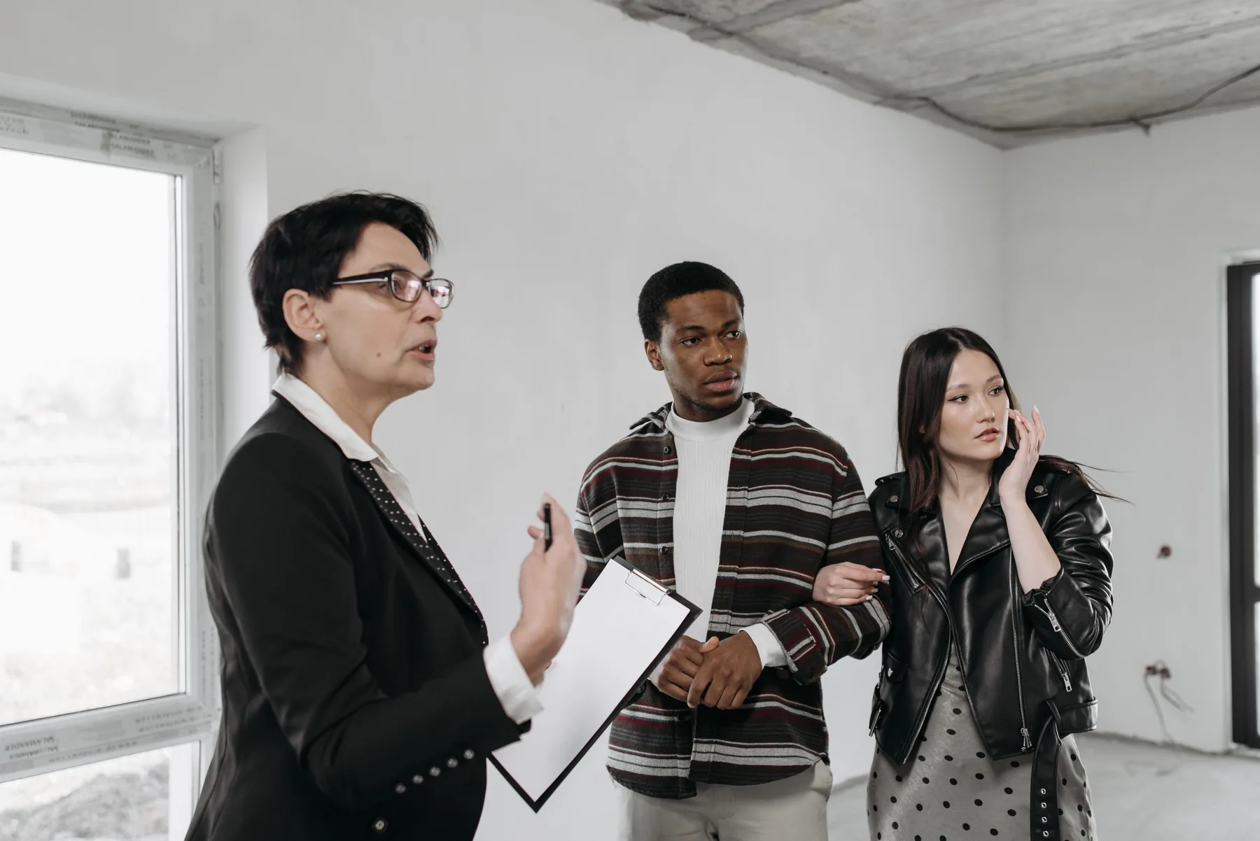 Couple discussing a home during a representative property viewing